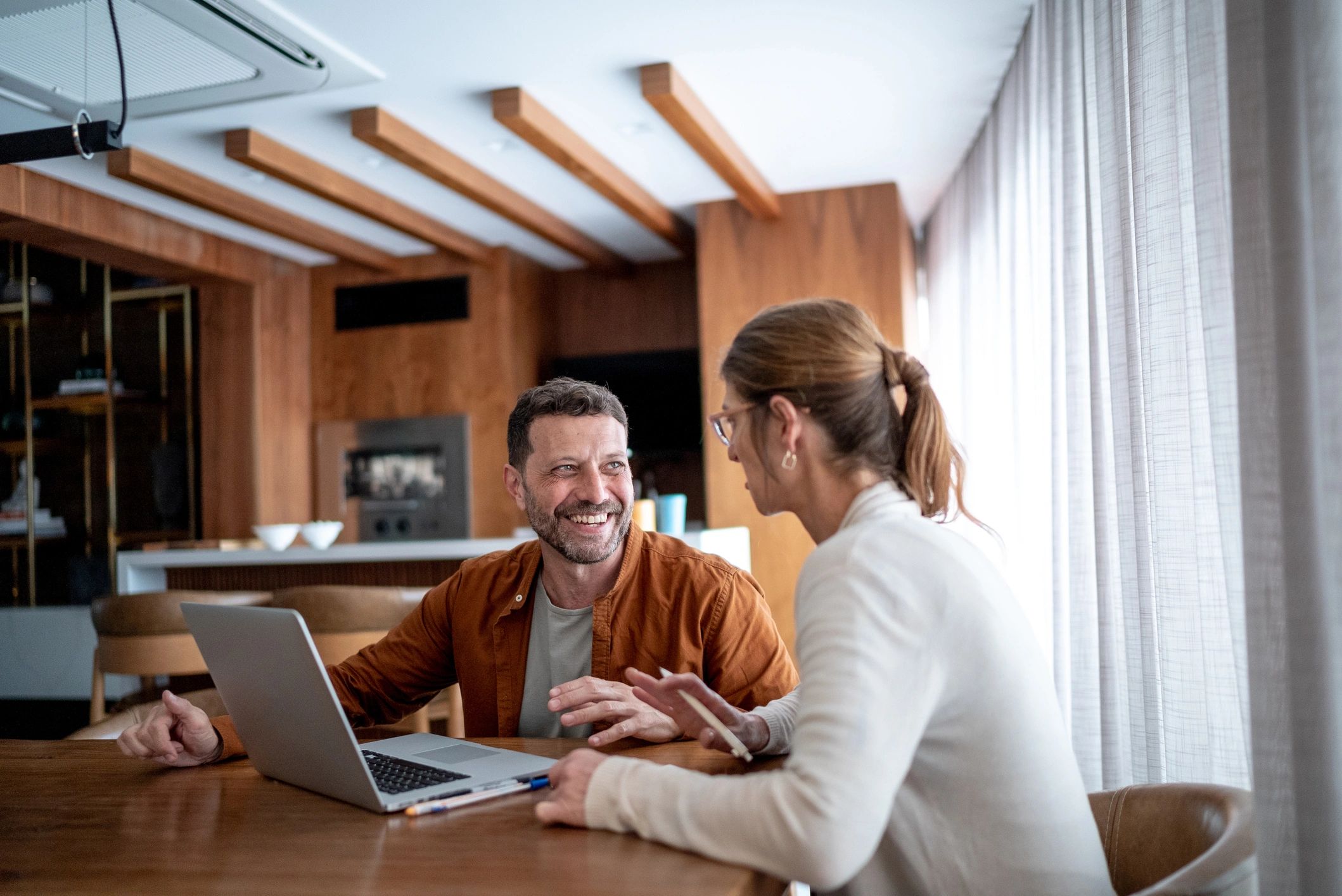 Couple reviewing home loan options on a laptop at home