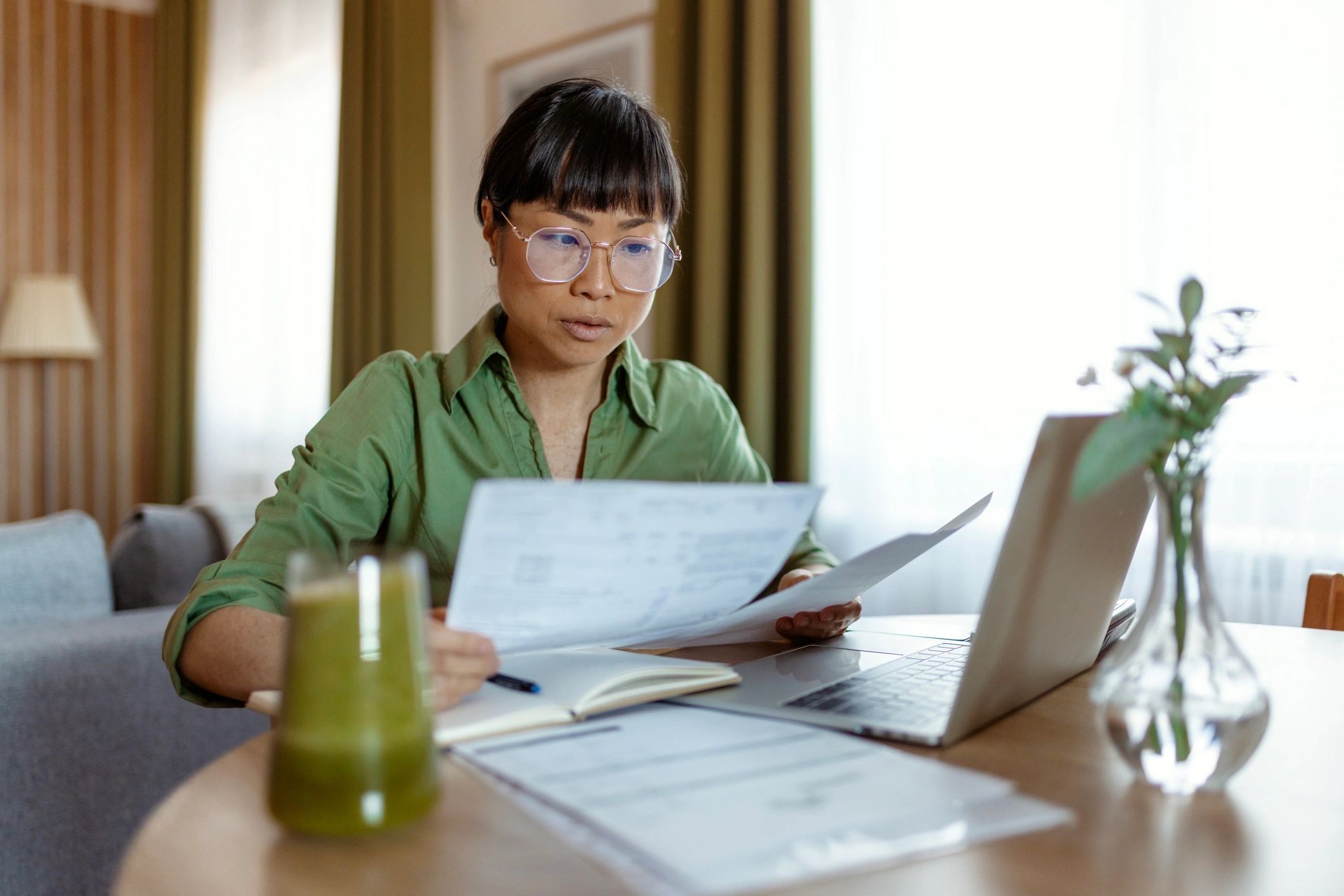 Professional reviewing financial documents and reports