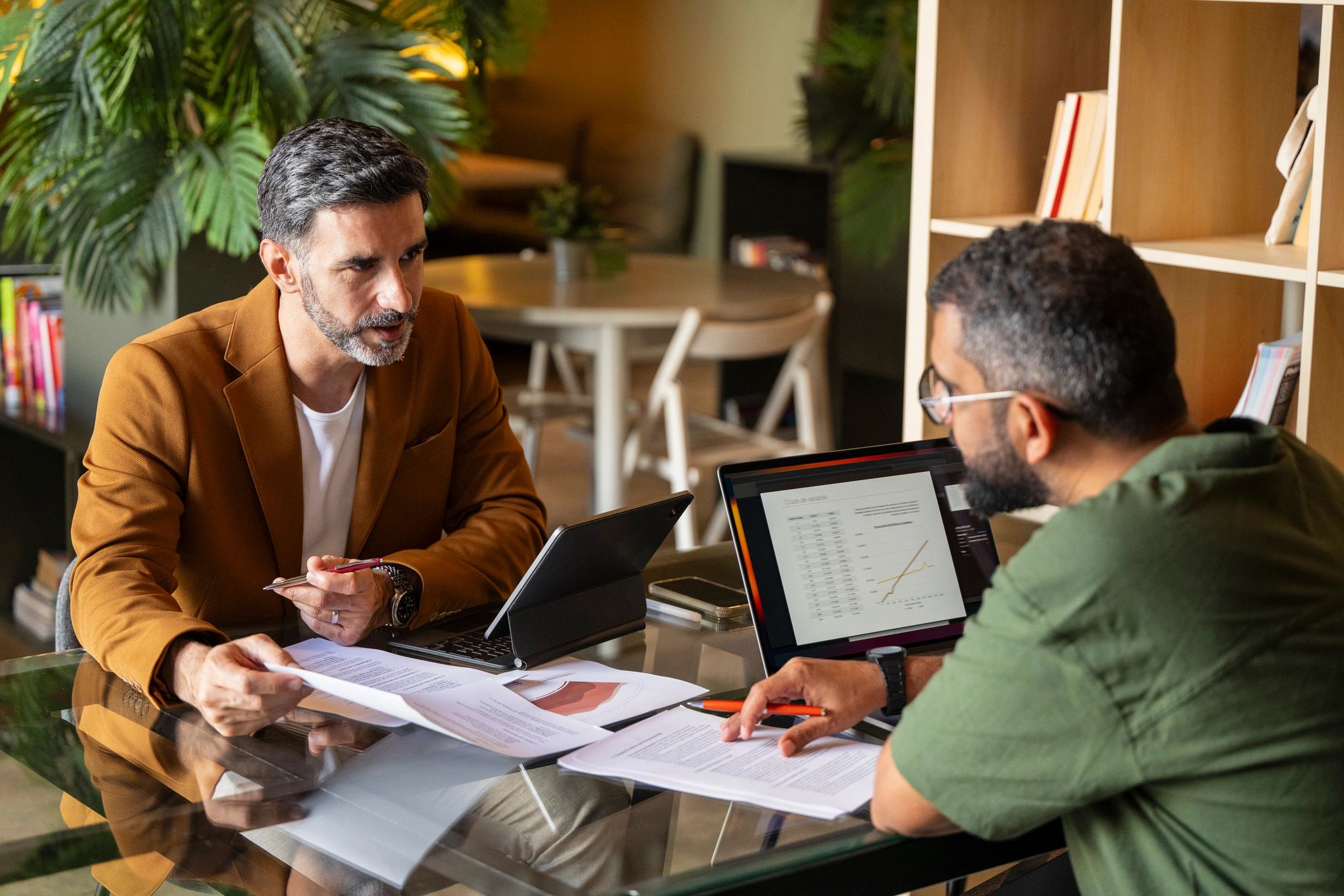 Mortgage broker consultation with clients reviewing loan options